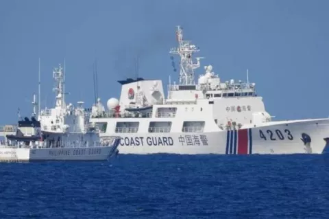 A Chinese Coast Guard ship allegedly obstructs the Philippine Coast Guard vessel Malabrigo as it provided support during a Philippine Navy operation near Second Thomas Shoal in the disputed South China Sea, June 30, 2023