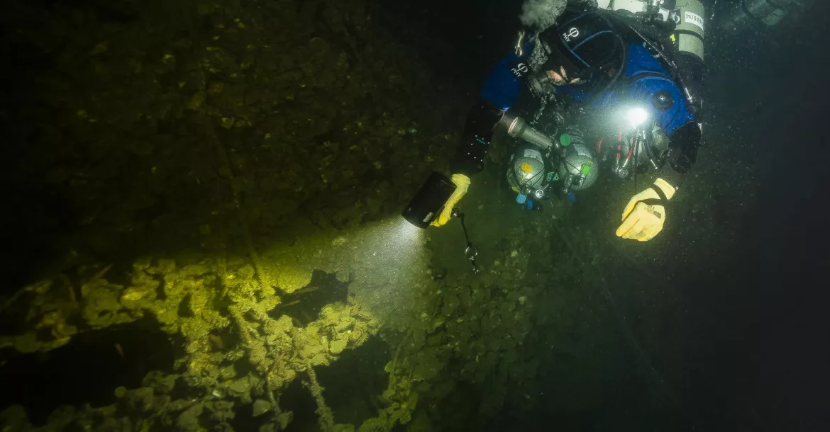 Diver explores the port side of UJ-2208, located off the coast of Genoa in Italy. Photo by Marco Mori.