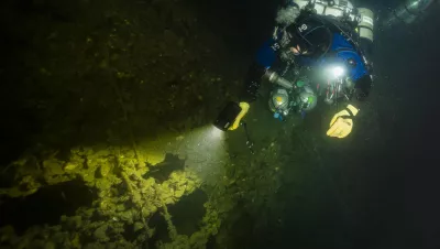 Diver explores the port side of UJ-2208, located off the coast of Genoa in Italy. Photo by Marco Mori.