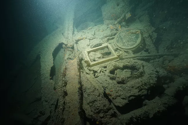 Square porthole  and wreck debris on the Lusitania. Photo by Vic Verlinden.