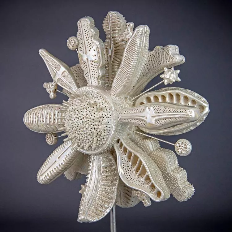 Flourish, by Marguerita Hagan. Hand-built ceramic, steel, silver leaf, 10 x 11 x 7in